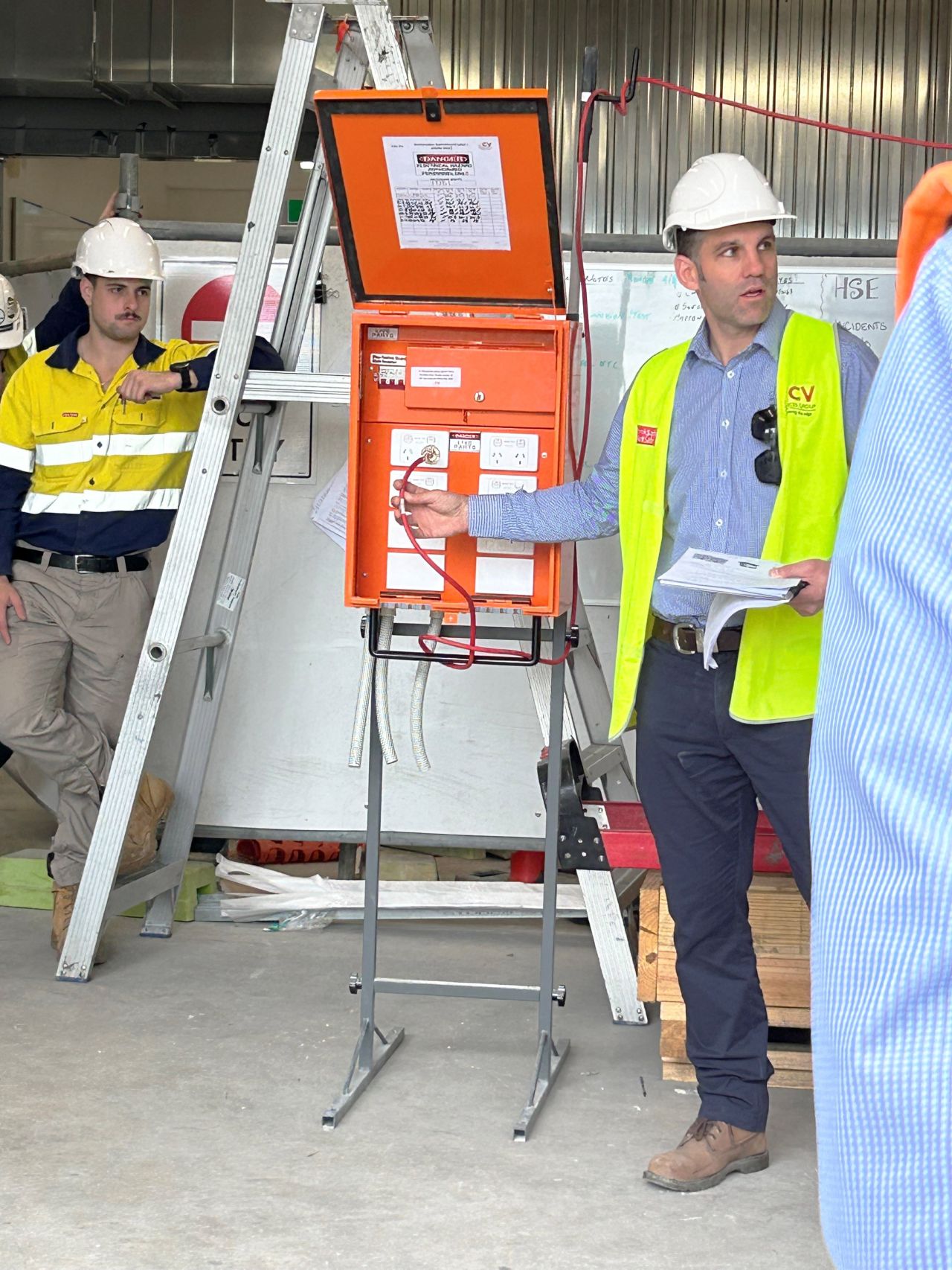 Construction Manager, Gary McCormick, from Wiley's partners at CV Services Group gives a safety toolbox talk for Electrical Safety Week to a group of subcontractors and Wiley staff